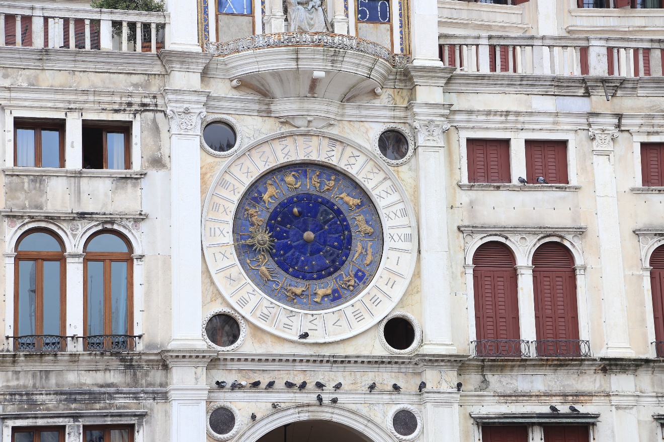Tower clock and pigeons